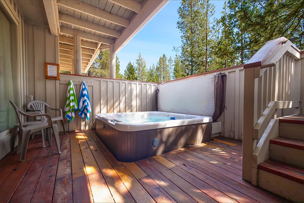 Sunriver vacation rental with private hot tub on lower level deck.